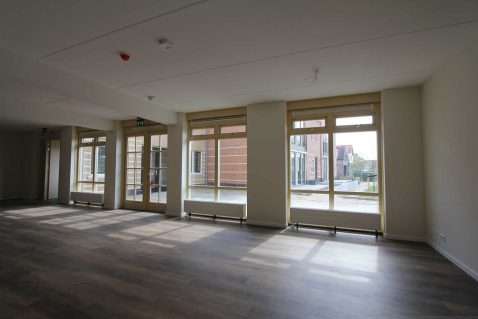 woonkamer en terras Herbergier